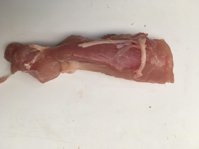 Strip of meat cut off thigh with spare rib cutter STEEN poultry processing machines